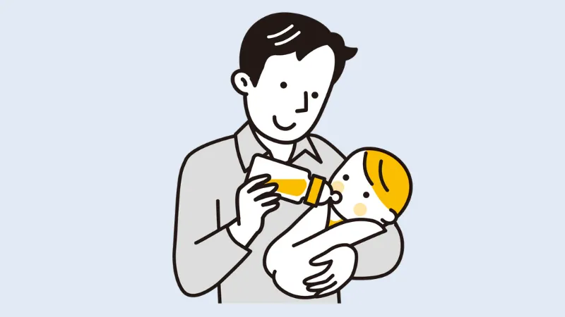 赤ちゃんにミルクをあげる男性