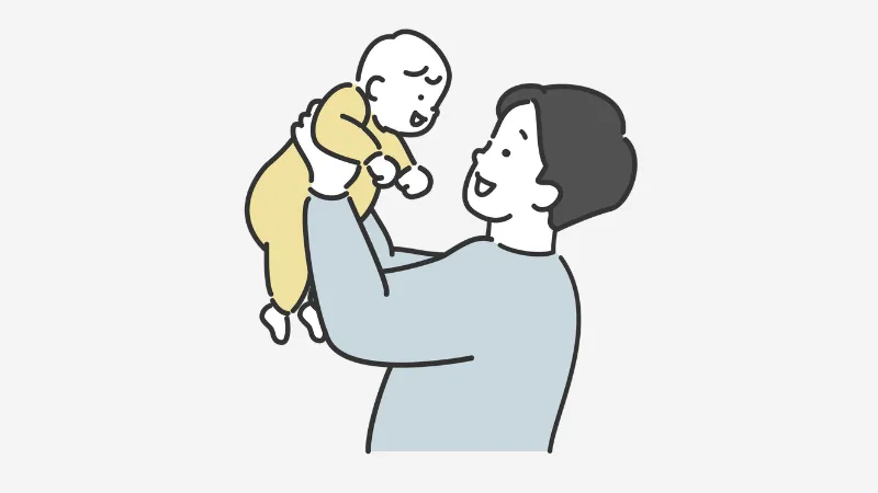 子どもを抱っこする男性
